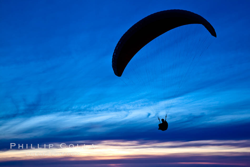 Paraglider soaring at Torrey Pines Gliderport, sunset, flying over the Pacific Ocean. La Jolla, California, USA, natural history stock photograph, photo id 24289