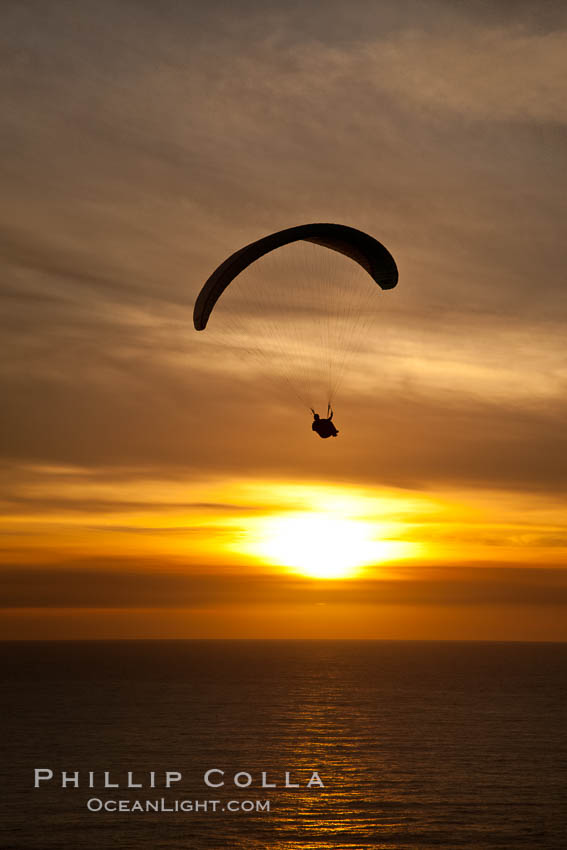 Paraglider soaring at Torrey Pines Gliderport, sunset, flying over the Pacific Ocean. La Jolla, California, USA, natural history stock photograph, photo id 24293