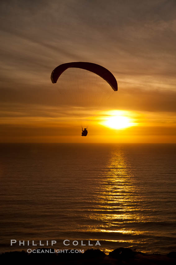 Paraglider soaring at Torrey Pines Gliderport, sunset, flying over the Pacific Ocean. La Jolla, California, USA, natural history stock photograph, photo id 24297