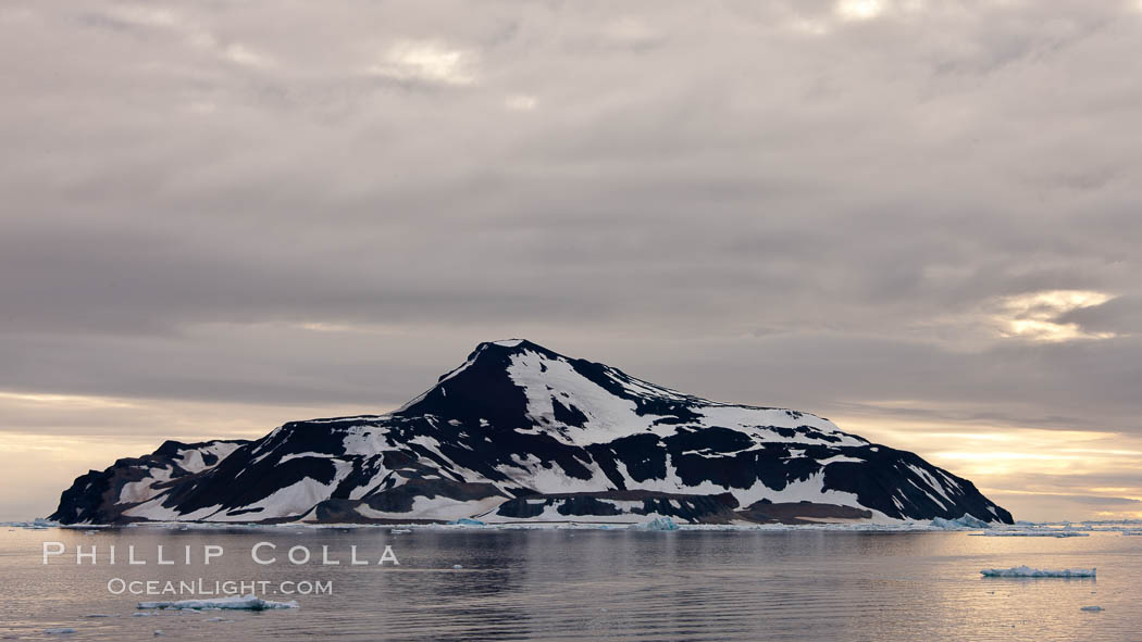 Paulet Island, near the Antarctic Peninsula, is a cinder cone flanks by lava flows on which thousands of Adelie Penguins nest. Antarctica, natural history stock photograph, photo id 24891