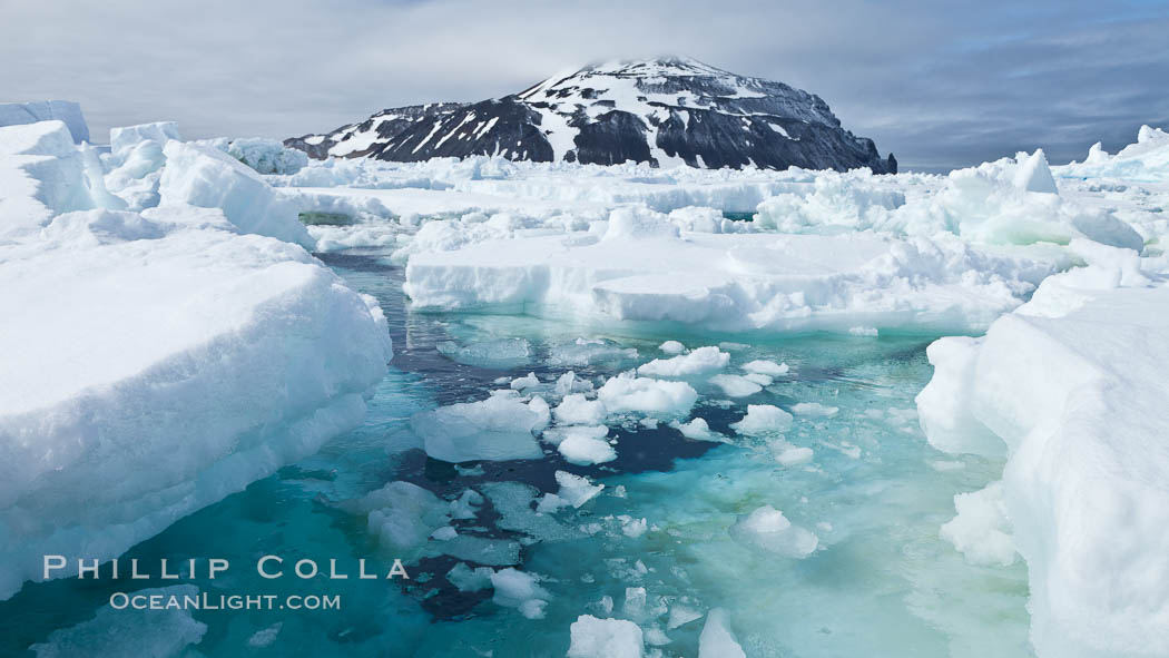 Paulet Island, near the Antarctic Peninsula, is a cinder cone flanks by lava flows on which thousands of Adelie Penguins nest. Antarctica, natural history stock photograph, photo id 26361