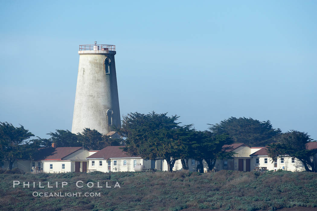 Piedras Blancas lighthouse.  Completed in 1875, the 115-foot-tall Piedras Blancas lighthouse is one of the few tall-style lighthouses on the West Coast of the United States.  Piedras Blancas, named for a group of three white rocks just offshore, is north of San Simeon, California very close to Hearst Castle. USA, natural history stock photograph, photo id 20349