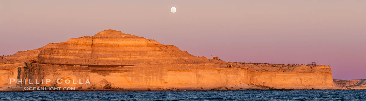 The Pyramid for which Puerto Piramides was named, with full moon rising as the sun sets. Patagonia