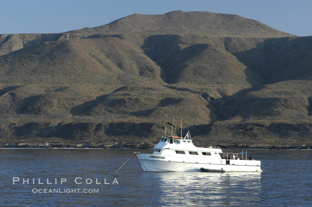 Dive boat Conception at anchor in Pyramid Cove.  San Clemente Island is used as a US Navy bombing target.  Its offshore kelp forests offer spectacular diving. California, USA, natural history stock photograph, photo id 07498