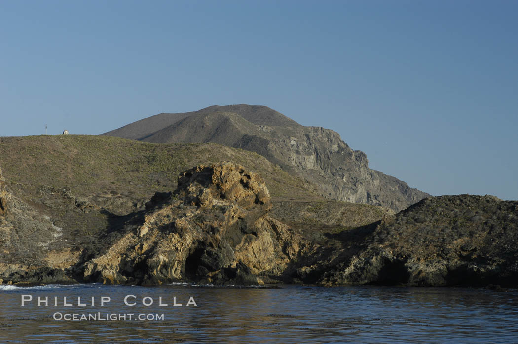 Rugged, volcanic coastline of San Clemente Island at Pyramid Cove, near the islands southeastern tip.  San Clemente Island is used as a US Navy bombing target. California, USA, natural history stock photograph, photo id 07502