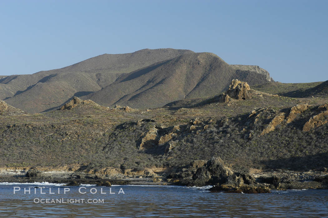 Rugged, volcanic coastline of San Clemente Island at Pyramid Cove, near the islands southeastern tip.  San Clemente Island is used as a US Navy bombing target. California, USA, natural history stock photograph, photo id 07503