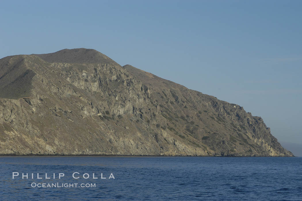 Southeastern coast of San Clemente Island rises sharply from the ocean. California, USA, natural history stock photograph, photo id 07501