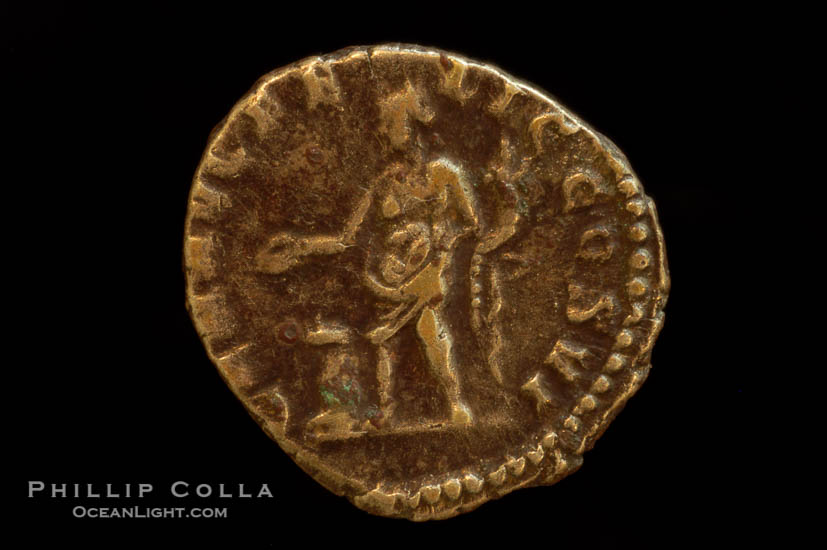 Roman emperor Commodus (177-192 A.D.), depicted on ancient Roman coin (silver, denom/type: Denarius) (AR , Denarius Obverse: M.COMM.ANT.P.FEL.AVG.BRIT.PP. Reverse: GEN.AVG.FLIC.COS.VI.  Genius standing left sacrificing scepter from a patera over an alter.)., natural history stock photograph, photo id 06798