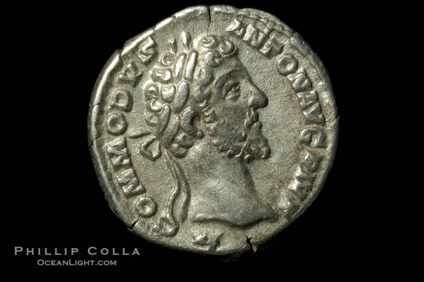 Roman emperor Commodus (177-192 A.D.), depicted on ancient Roman coin (silver, denom/type: Denarius) (AR , Denarius Obverse: M.COMMODVS.ANTON.AVG.PIVS. Reverse: PM.TR.P.VIIII.IMP.VI.COS.IIII.PP. Providentia standing left holding scepter and using baton to point to globe.)., natural history stock photograph, photo id 06568