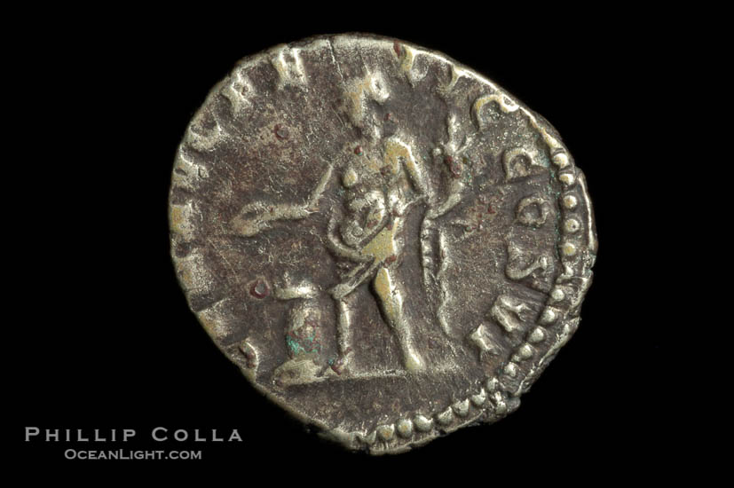 Roman emperor Commodus (177-192 A.D.), depicted on ancient Roman coin (silver, denom/type: Denarius) (AR , Denarius Obverse: M.COMM.ANT.P.FEL.AVG.BRIT.PP. Reverse: GEN.AVG.FLIC.COS.VI.  Genius standing left sacrificing scepter from a patera over an alter.)., natural history stock photograph, photo id 06799