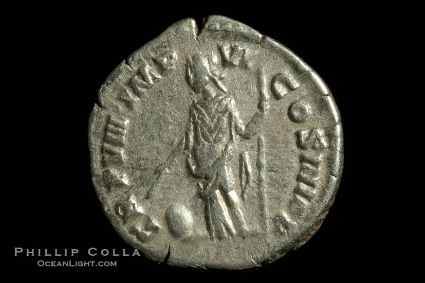 Roman emperor Commodus (177-192 A.D.), depicted on ancient Roman coin (silver, denom/type: Denarius) (AR , Denarius Obverse: M.COMMODVS.ANTON.AVG.PIVS. Reverse: PM.TR.P.VIIII.IMP.VI.COS.IIII.PP. Providentia standing left holding scepter and using baton to point to globe.)., natural history stock photograph, photo id 06569