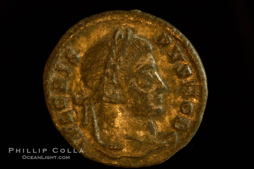 Roman emperor Crispus (316-326 A.D.), depicted on ancient Roman coin (bronze, denom/type: AE3) (AE3. Reverse: C, AESRVM NOSTRORVM. Wreath enclosing VOT V.)., natural history stock photograph, photo id 06694