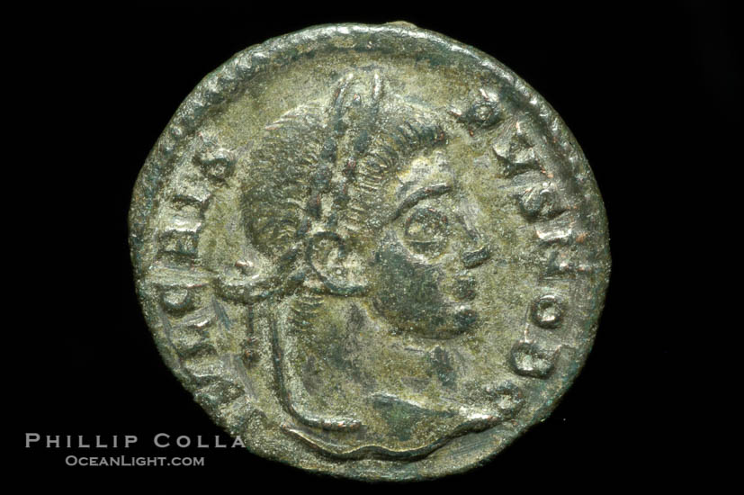 Roman emperor Crispus (316-326 A.D.), depicted on ancient Roman coin (bronze, denom/type: AE3) (AE3. Reverse: C, AESRVM NOSTRORVM. Wreath enclosing VOT V.)., natural history stock photograph, photo id 06695
