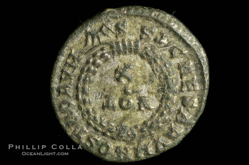 Roman emperor Crispus (316-326 A.D.), depicted on ancient Roman coin (bronze, denom/type: AE3) (AE3. Reverse: C, AESRVM NOSTRORVM. Wreath enclosing VOT V.)., natural history stock photograph, photo id 06697