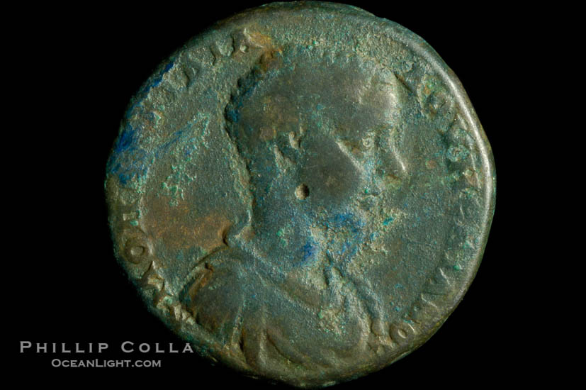 Roman emperor Diadumenian (217-218 A.D.), depicted on ancient Roman coin (bronze, denom/type: AE25) (AE 25 of Nicopolis in Moesia. Obverse: Draped and cuirassed bust right. Reverse: Tyche standing left, holds rudder and cornucopia. VG.)., natural history stock photograph, photo id 06584