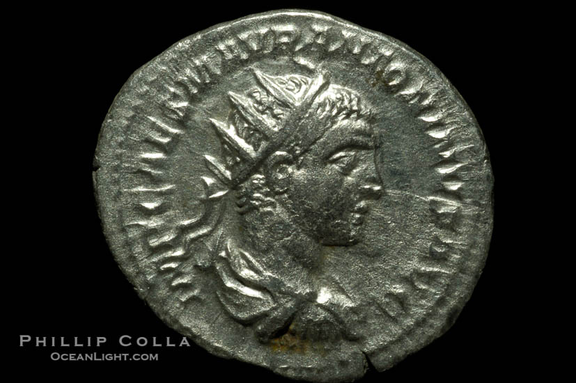 Roman emperor Elegabalus (218-222 A.D.), depicted on ancient Roman coin (silver, denom/type: Antoninianus) (Antoninianus Obverse: IMP.CAES.M.AVR.ANTONINUS.AVG. Reverse: SALUS.ANTONINI.AVG. salus standing half right, holding snake across body and feeding it.)., natural history stock photograph, photo id 06588