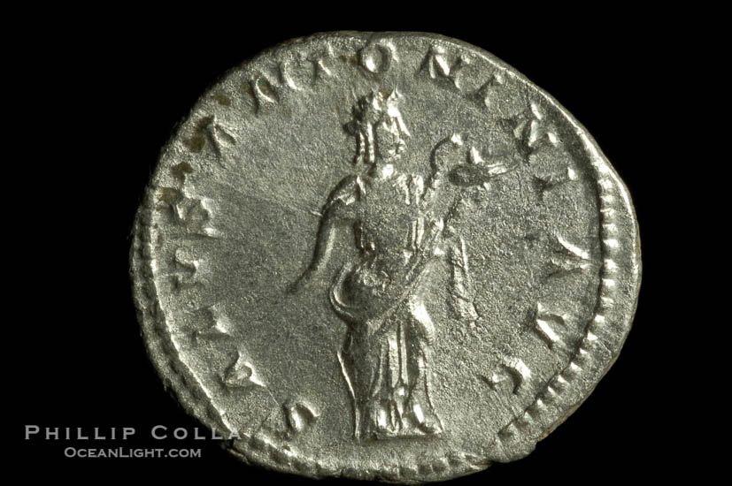 Roman emperor Elegabalus (218-222 A.D.), depicted on ancient Roman coin (silver, denom/type: Antoninianus) (Antoninianus Obverse: IMP.CAES.M.AVR.ANTONINUS.AVG. Reverse: SALUS.ANTONINI.AVG. salus standing half right, holding snake across body and feeding it.)., natural history stock photograph, photo id 06589