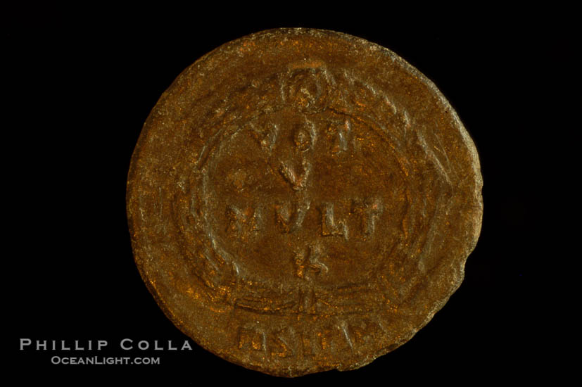 Roman emperor Jovian (363-364 A.D.), depicted on ancient Roman coin (bronze, denom/type: AE3) (AE3. nVF. Reverse: legend in wreath VOT V MVLT X.3.)., natural history stock photograph, photo id 06720