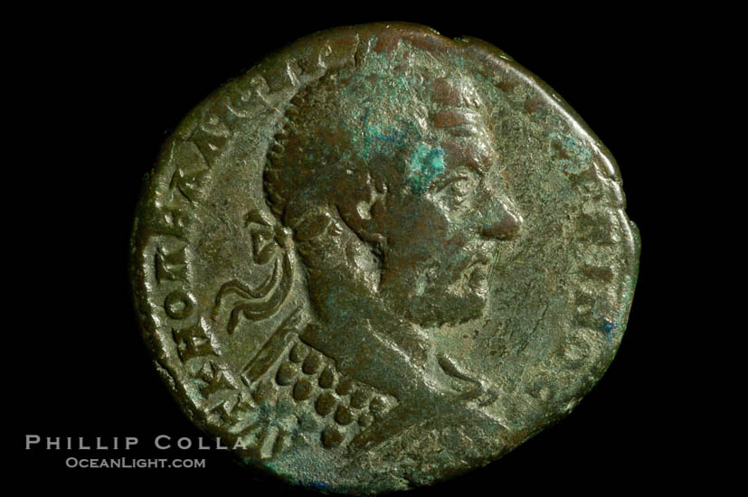 Roman emperor Macrinus (217-218 A.D.), depicted on ancient Roman coin (bronze, denom/type: AE27) (AE 27 of Nicopolis in Moesia, under Legate Statius Longinus; F+. Obverse: Laureated, draped, cuirassed bust right. Reverse: Apollo standing left, holds branch.)., natural history stock photograph, photo id 06582