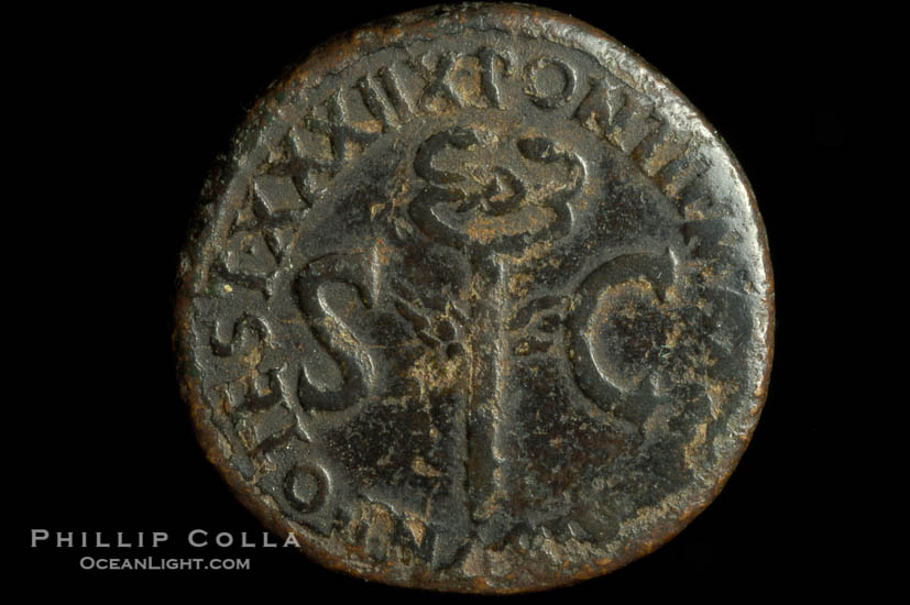 Roman emperor Tiberius (14-37 A.D.), depicted on ancient Roman coin (bronze, denom/type: As) (As, F; Winged caduceus.)., natural history stock photograph, photo id 06779