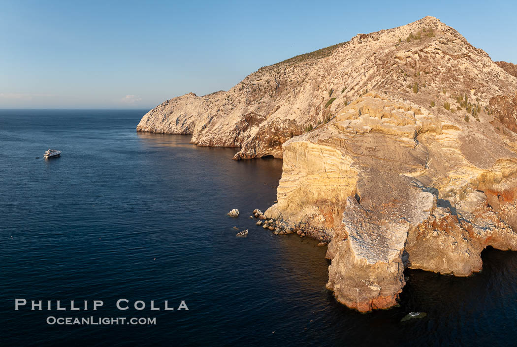 Rugged Terrain of Isla San Pedro Martir, Sea of Cortez. Aerial photo. The large bird population deposits enormous quantities of guano on the island, resulting in the white appearance of the island contrasted with sparse vegetation. In the late 19th and early 20th century guano was heavily mined off the island and shipped as far as Europe for use as fertilizer. San Pedro Martir is seldom visited, having near vertical sides leaving only questionable fair weather anchorages in two locations. Landing access was possible near a small isthmus in the southeast of the island, but is now forbidden. In 2005, the island was classified along with 244 others as a World Heritage Site by UNESCO, and included in the Islands and Protected Areas of the Gulf of California Rugged Terrain of Isla San Pedro Martir, Sea of Cortez. Aerial photo. The large bird population deposits enormous quantities of guano on the island, resulting in the white appearance of the island contrasted with sparse vegetation. In the late 19th and early 20th century guano was heavily mined off the island and shipped as far as Europe for use as fertilizer. San Pedro Martir is seldom visited, having near vertical sides leaving only questionable fair weather anchorages in two locations. Landing access was possible near a small isthmus in the southeast of the island, but is now forbidden. In 2005, the island was classified along with 244 others as a World Heritage Site by UNESCO, and included in the Islands and Protected Areas of the Gulf of California