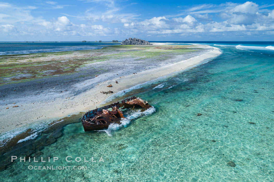 Rusting shipwreck on the beach at Clipperton Island, aerial photo, Clipperton Island is a spectacular coral atoll in the eastern Pacific. By permit HC / 1485 / CAB (France)., natural history stock photograph, photo id 32838