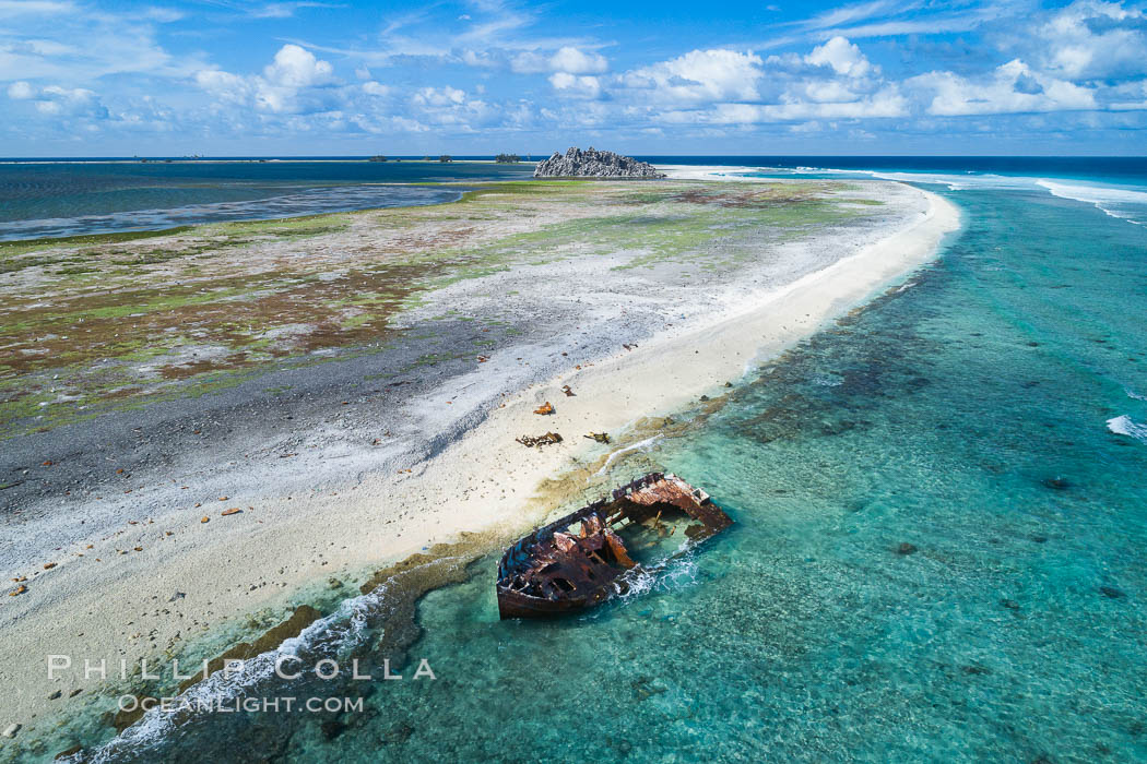 Rusting shipwreck on the beach at Clipperton Island, aerial photo, Clipperton Island is a spectacular coral atoll in the eastern Pacific. By permit HC / 1485 / CAB (France)., natural history stock photograph, photo id 32926
