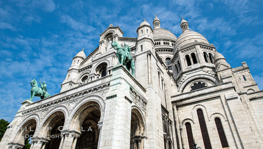 Sacre-Coeur Basilica. The Basilica of the Sacred Heart of Paris, commonly known as Sacre-Coeur Basilica, is a Roman Catholic church and minor basilica, dedicated to the Sacred Heart of Jesus, in Paris, France. A popular landmark, the basilica is located at the summit of the butte Montmartre, the highest point in the city., natural history stock photograph, photo id 35715