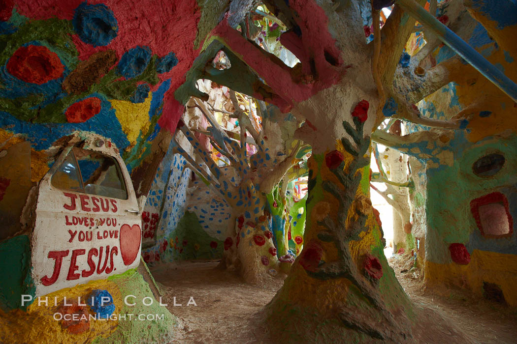 Salvation Mountain, near the desert community of Slab City and the small town of Niland on the east side of the Salton Sea.  Built over several decades by full-time resident Leonard Knight, who lives at the site, Salvation Mountain was built from over 100,000 gallons of paint, haybales, wood and metal and was created by Mr. Knight to convey the message that "God Loves Everyone". California, USA, natural history stock photograph, photo id 22506