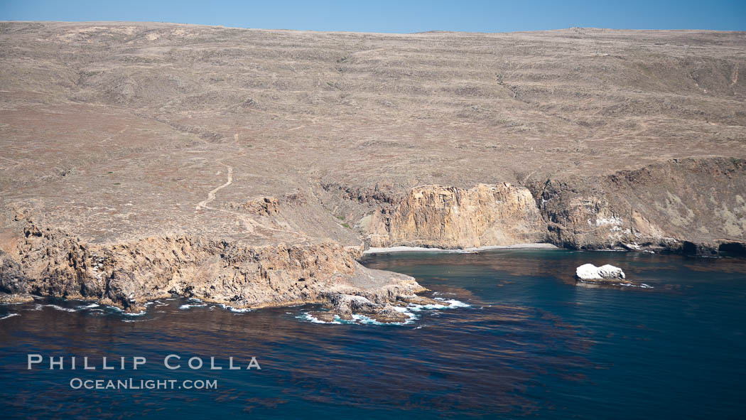 San Clemente Island, rugged barren coastline and island terrain surrounded by lush underwater kelp forests and marine life. California, USA, natural history stock photograph, photo id 26014