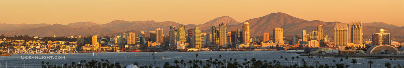 San Diego city skyline, showing the buildings of downtown San Diego rising above San Diego Harbor, viewed from Point Loma at sunset, with mountains of the Cleveland National Forest rising in the distance. A panoramic photograph, composite of seven separate images. California, USA, natural history stock photograph, photo id 22257