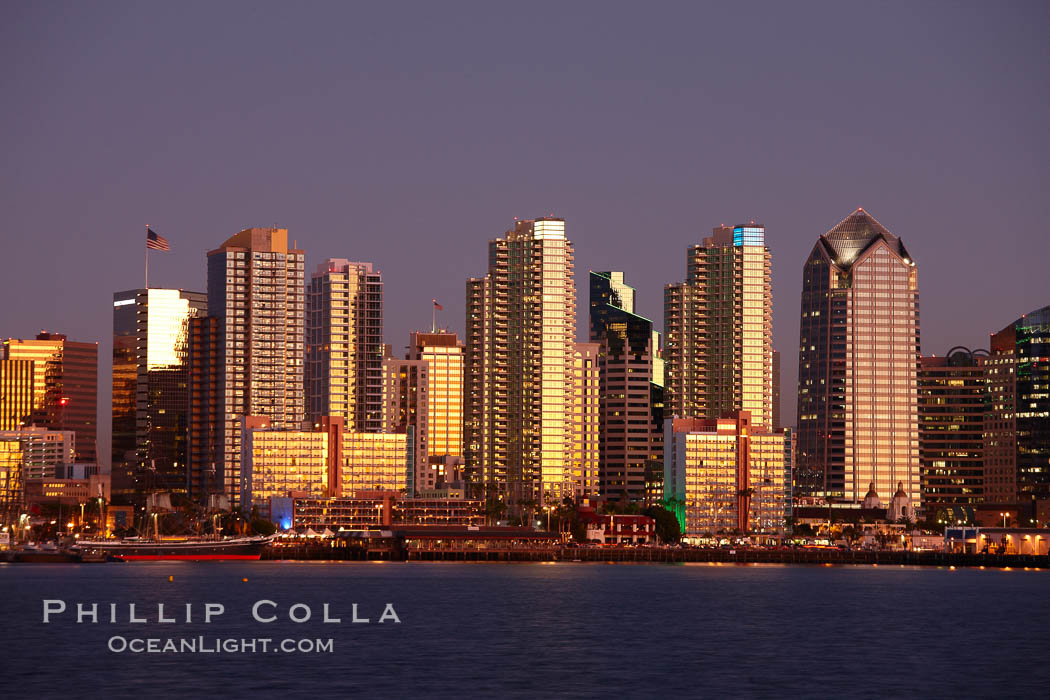 San Diego city skyline at sunset, showing the buildings of downtown San Diego rising above San Diego Harbor, viewed from Harbor Island. California, USA, natural history stock photograph, photo id 22264