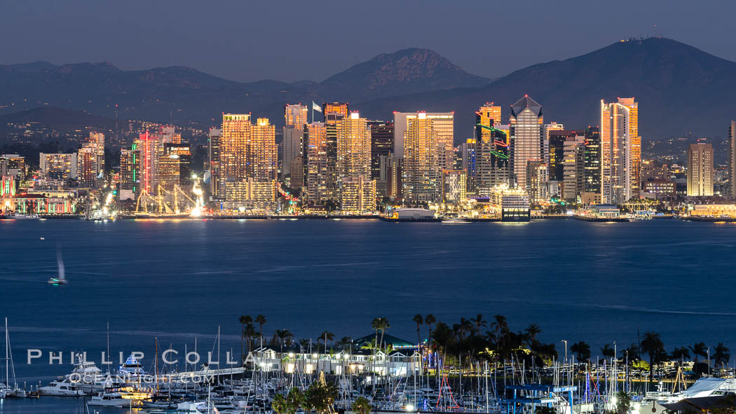 San Diego City Skyline at Sunset, viewed from Point Loma, panoramic photograph. The mountains east of San Diego can be clearly seen when the air is cold, dry and clear as it is in this photo. Lyons Peak is in center and Mount San Miguel to the right., natural history stock photograph, photo id 37504