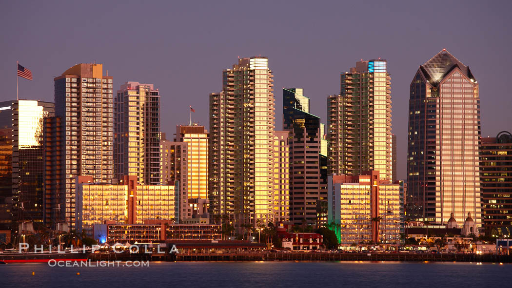 San Diego city skyline at sunset, showing the buildings of downtown San Diego rising above San Diego Harbor, viewed from Harbor Island. California, USA, natural history stock photograph, photo id 22249