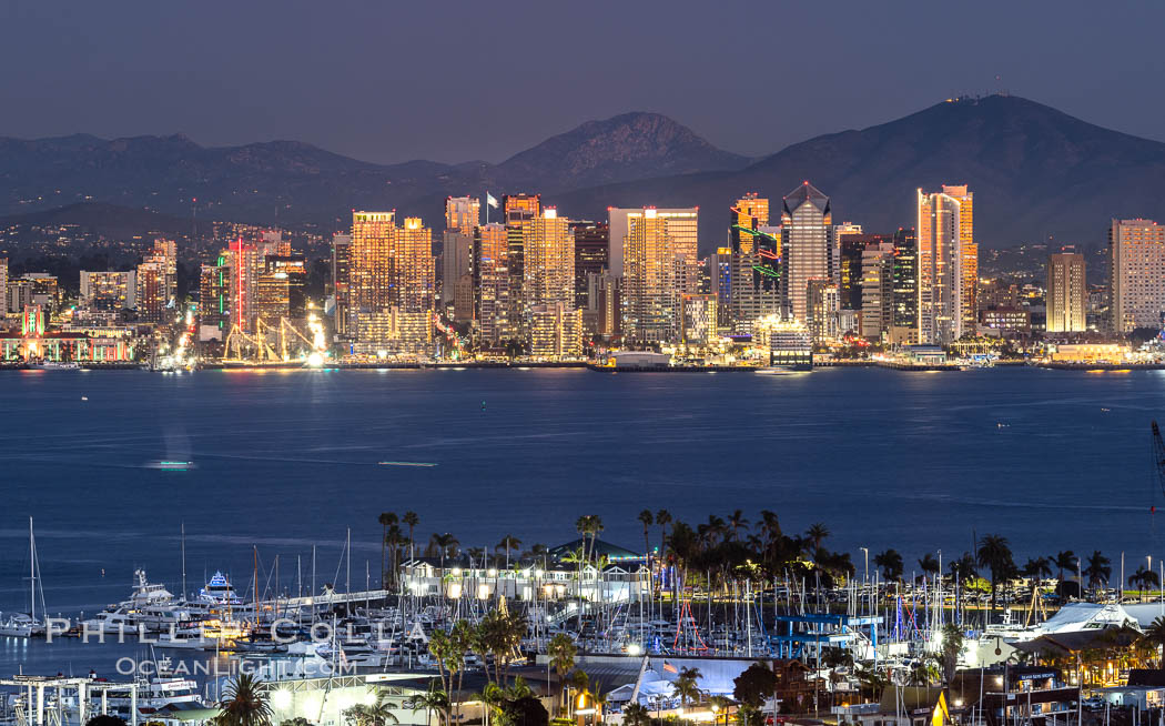 San Diego City Skyline at Sunset, viewed from Point Loma, panoramic photograph. The mountains east of San Diego can be clearly seen when the air is cold, dry and clear as it is in this photo. Lyons Peak is in center and Mount San Miguel to the right. California, USA, natural history stock photograph, photo id 37505