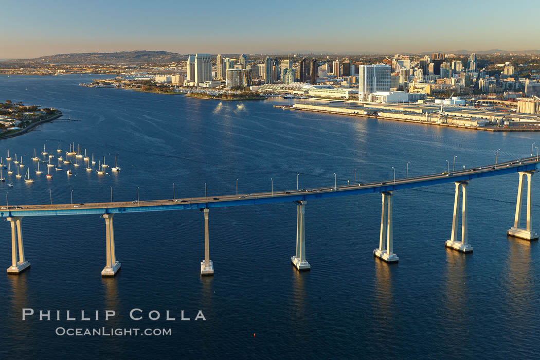 San Diego Coronado Bridge, known locally as the Coronado Bridge, links San Diego with Coronado, California.  The bridge was completed in 1969 and was a toll bridge until 2002.  It is 2.1 miles long and reaches a height of 200 feet above San Diego Bay.  Coronado Island is to the left, and downtown San Diego is to the right in this view looking north. USA, natural history stock photograph, photo id 22306