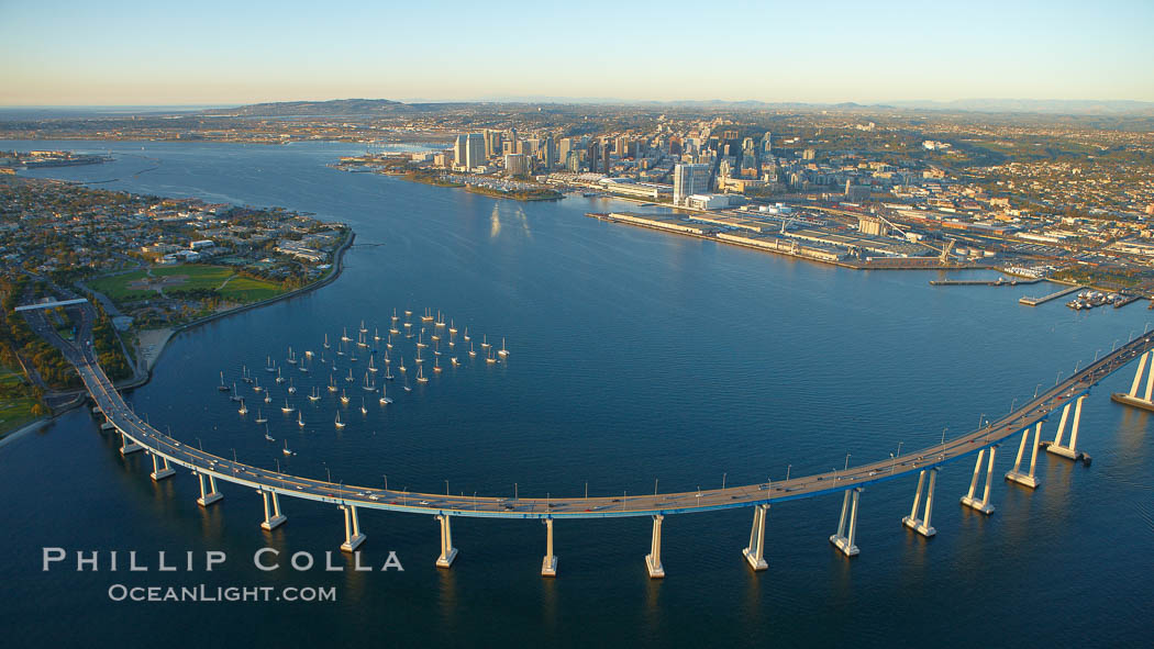 San Diego Coronado Bridge, known locally as the Coronado Bridge, links San Diego with Coronado, California.  The bridge was completed in 1969 and was a toll bridge until 2002.  It is 2.1 miles long and reaches a height of 200 feet above San Diego Bay.  Coronado Island is to the left, and downtown San Diego is to the right in this view looking north. USA, natural history stock photograph, photo id 22466