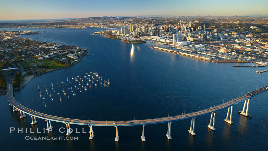 San Diego Coronado Bridge, known locally as the Coronado Bridge, links San Diego with Coronado, California.  The bridge was completed in 1969 and was a toll bridge until 2002.  It is 2.1 miles long and reaches a height of 200 feet above San Diego Bay.  Coronado Island is to the left, and downtown San Diego is to the right in this view looking north. USA, natural history stock photograph, photo id 22432