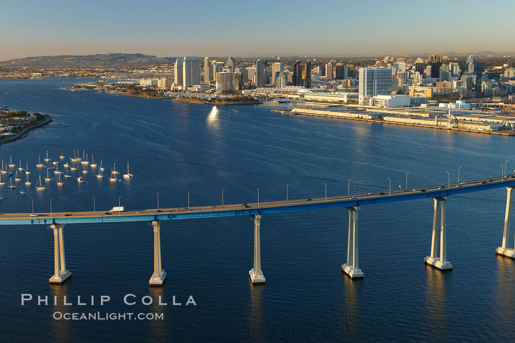 San Diego Coronado Bridge, known locally as the Coronado Bridge, links San Diego with Coronado, California.  The bridge was completed in 1969 and was a toll bridge until 2002.  It is 2.1 miles long and reaches a height of 200 feet above San Diego Bay.  Coronado Island is to the left, and downtown San Diego is to the right in this view looking north. USA, natural history stock photograph, photo id 22460