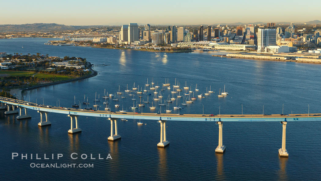San Diego Coronado Bridge, known locally as the Coronado Bridge, links San Diego with Coronado, California.  The bridge was completed in 1969 and was a toll bridge until 2002.  It is 2.1 miles long and reaches a height of 200 feet above San Diego Bay.  Coronado Island is to the left, and downtown San Diego is to the right in this view looking north. USA, natural history stock photograph, photo id 22299
