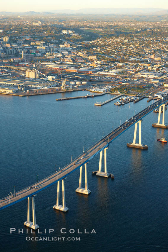 San Diego Coronado Bridge, known locally as the Coronado Bridge, links San Diego with Coronado, California.  The bridge was completed in 1969 and was a toll bridge until 2002.  It is 2.1 miles long and reaches a height of 200 feet above San Diego Bay.  Coronado Island is to the left, and downtown San Diego is to the right in this view looking north. USA, natural history stock photograph, photo id 22467