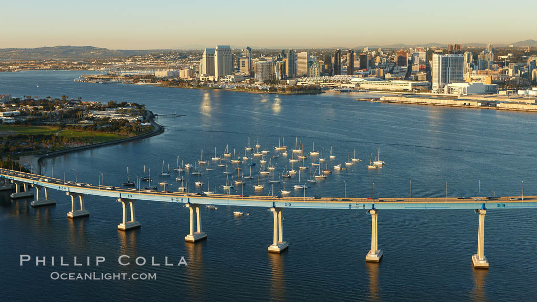 San Diego Coronado Bridge, known locally as the Coronado Bridge, links San Diego with Coronado, California.  The bridge was completed in 1969 and was a toll bridge until 2002.  It is 2.1 miles long and reaches a height of 200 feet above San Diego Bay.  Coronado Island is to the left, and downtown San Diego is to the right in this view looking north. USA, natural history stock photograph, photo id 22461