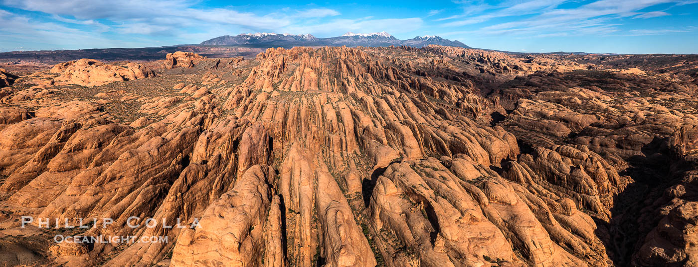 Sandstone Fins at sunset, near Moab Utah. Fins like these form in sandstone and eventually some will continue to erode until they form natural stone arches, such as those in Arches National Park. USA, natural history stock photograph, photo id 38224