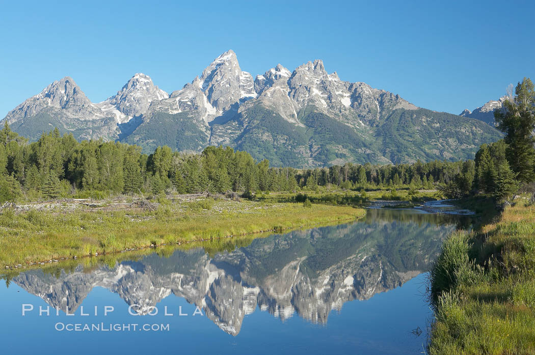 The Teton Range is reflected in the glassy waters of the Snake River at Schwabacher Landing. Grand Teton National Park, Wyoming, USA, natural history stock photograph, photo id 12995