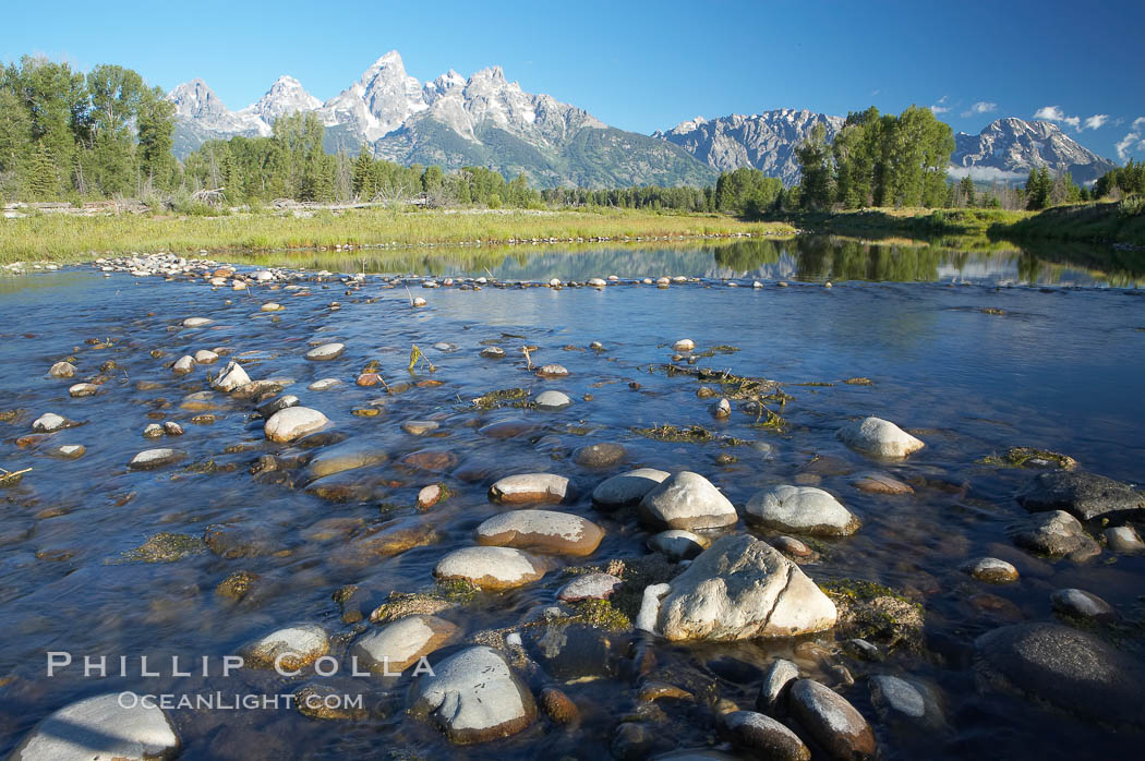 The Teton Range rises above river rocks in the Snake River at Schwabacher Landing. Grand Teton National Park, Wyoming, USA, natural history stock photograph, photo id 12989