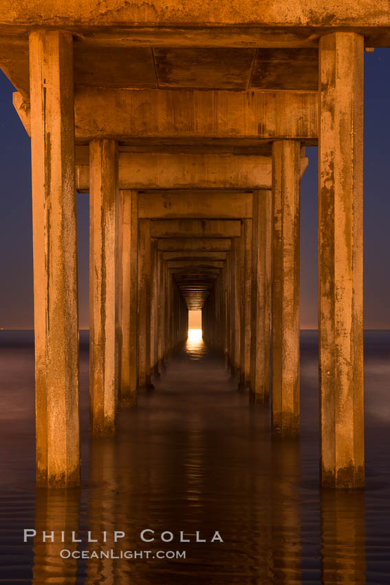 Full moon setting over the Pacific lights the inside of Scripps Pier. La Jolla, California, USA, natural history stock photograph, photo id 28983