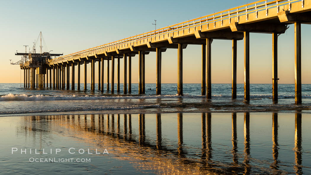 SIO Pier. The Scripps Institution of Oceanography research pier is 1090 feet long and was built of reinforced concrete in 1988, replacing the original wooden pier built in 1915. The Scripps Pier is home to a variety of sensing equipment above and below water that collects various oceanographic data. The Scripps research diving facility is located at the foot of the pier. Fresh seawater is pumped from the pier to the many tanks and facilities of SIO, including the Birch Aquarium. The Scripps Pier is named in honor of Ellen Browning Scripps, the most significant donor and benefactor of the Institution. La Jolla, California, USA, natural history stock photograph, photo id 36558