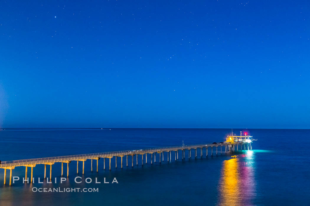 Scripps Institution of Oceanography Research Pier at night, lit with stars in the sky, old La Jolla town in the distance. California, USA, natural history stock photograph, photo id 28452