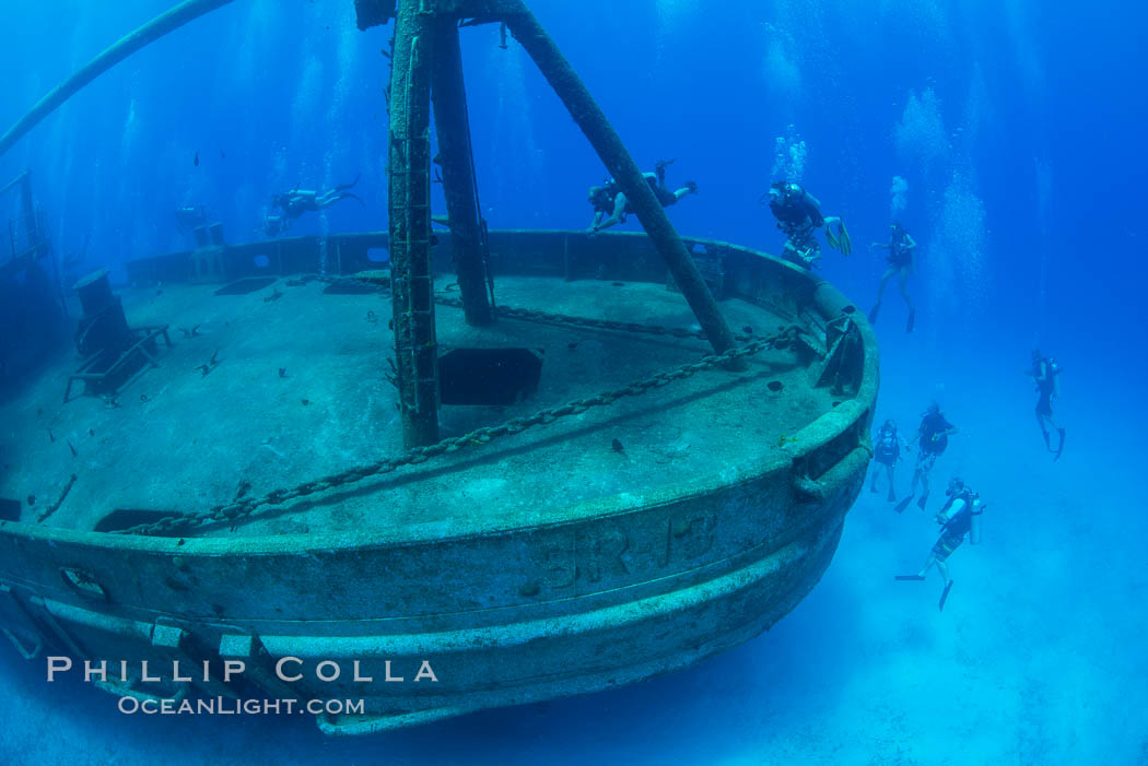 SCUBA divers on the wreck of the USS Kittiwake, sunk off Seven Mile Beach on Grand Cayman Island to form an underwater marine park and dive attraction. Cayman Islands, natural history stock photograph, photo id 32146