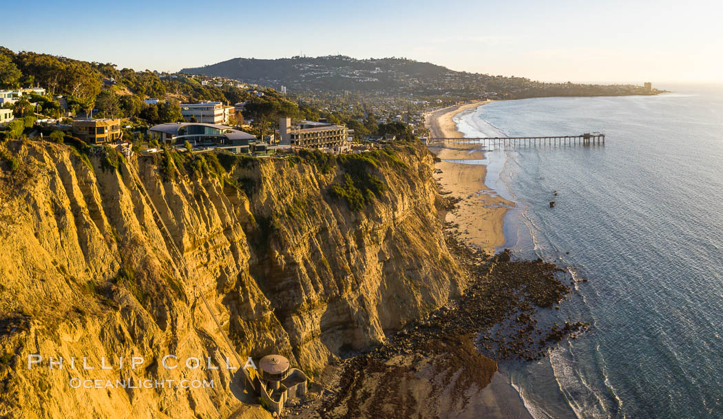 Scripps Beach Sea Cliffs and mushroom house, aerial photo. Mushroom House with its private elevator. Scripps Pier, Scripps Institution of Oceanography, and Mount Soledad in the distance. La Jolla, California, USA, natural history stock photograph, photo id 37943